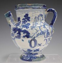 A Savona maiolica syrup or wet drug jar, early 18th century, painted in blue with two winged cherubs