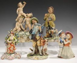 A group of Continental pottery and porcelain figures, late 19th and 20th century, including a