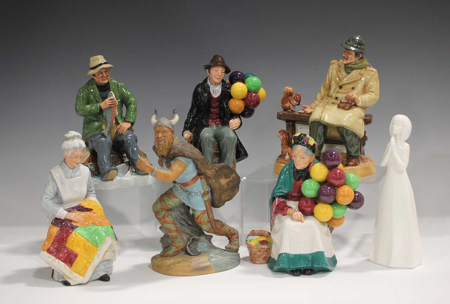 Seven Royal Doulton figures, comprising A Good Catch, HN2258, height 18.5cm, Eventide, HN2814, The