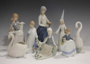 Three Lladro figures, comprising Shepherdess with Dove, No. 4660, Girl with Lamb, No.4835, and Fairy