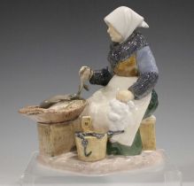 A Bing & Grondahl figure of a Fish Seller, No 2233, designed by Axel Locher, height 21cm.