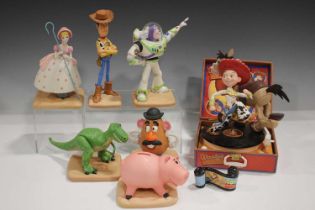 A set of Walt Disney Classics Collection Toy Story figures, comprising Woody, Buzz Lightyear (