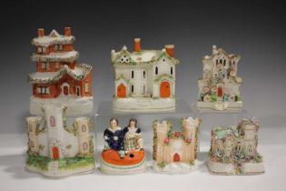 A Staffordshire pottery flatback money box, 19th century, modelled as a three-storey house, height