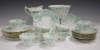 A Wileman Foley China part tea service, printed in green with oval panels of classical figures