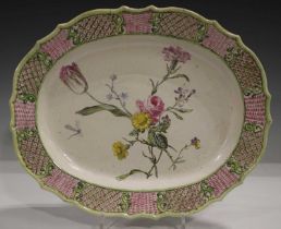 A large Staffordshire saltglazed stoneware oval dish or platter, circa 1760, the rim moulded with