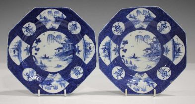 A pair of Bow porcelain octagonal plates, each with powder blue ground, circa 1760-1765, painted