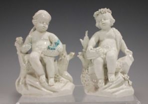 A matched pair of white glazed porcelain figures, probably Mennecy, circa 1760, modelled as seated