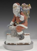 A Lladro limited edition figure group Down the Chimney, No. 1931, signed and numbered to base,