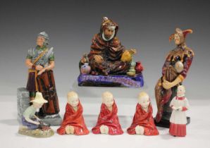 Eight Royal Doulton figures, comprising The Jester, HN2016, height 26cm, The Potter, HN1493, The