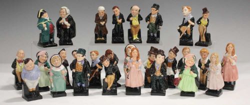 Twenty-eight Royal Doulton small Dickens character figures, raised on black glazed bases,