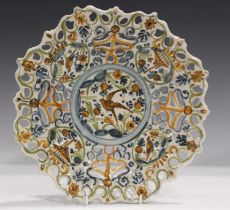 A maiolica low-footed tazza, probably Savona, late 17th/18th century, painted in ochre, green and