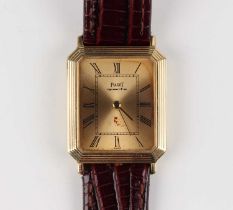 A Piaget Quartz 18ct gold cut cornered rectangular cased wristwatch, the signed gilt dial with black