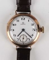 An Omega 9ct gold circular cased trench style gentleman's wristwatch with signed and jewelled