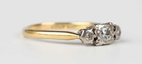 A gold, platinum and diamond ring, mounted with the principal circular cut diamond between two