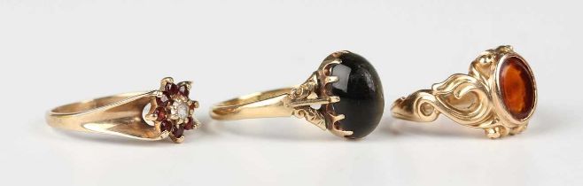 An 18ct gold ring, claw set with an oval quartz cat’s eye, weight 4.1g, ring size approx T1/2, a 9ct