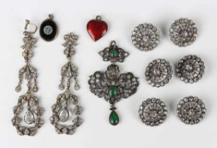 A Continental silver, colourless and green paste set pendant, circa 1900, in a pierced scrolling