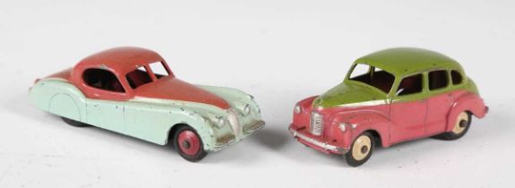 A Dinky Toys No. 157 Jaguar in turquoise and burgundy, and a No. 152 Austin Devon in pink and