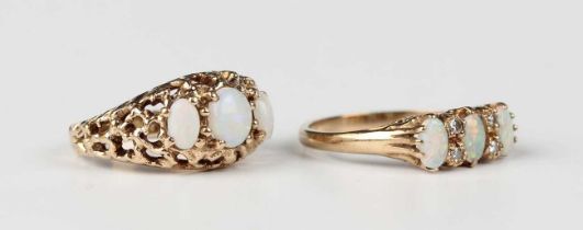 A 9ct gold ring, mounted with three oval opals alternating with two pairs of circular cut