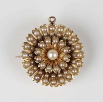 An Edwardian gold and half-pearl brooch, designed as a flowerhead, unmarked, weight 10.6g, width 2.