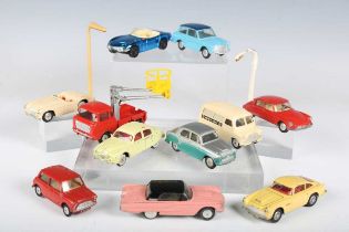 Eleven Corgi Toys vehicles, including No. 201 Austin Cambridge in metallic silver and green, No. 216