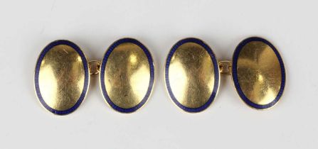 A pair of gold and blue enamelled oval cufflinks, each front with a blue enamelled border,