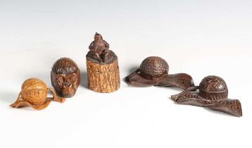 A late 19th century carved treen novelty inkwell in the form of a monkey's head, height 7cm, another