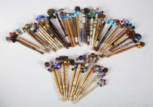 A large quantity of lace-making bobbins, including some 19th century examples, together with related
