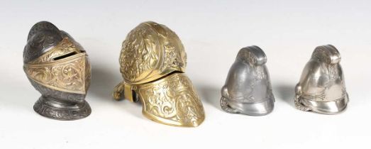 An early 20th century cast spelter and brass novelty inkwell in the form of a knight's helmet,