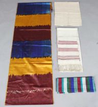 A group of ethnic textiles, including a Burmese sazigyo manuscript binding tape, a Burmese Inle Lake