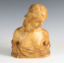 An early 20th century amber-coloured plaster head and shoulders bust of a young lady, the reverse