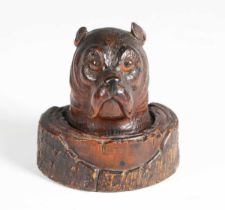 A late 19th century Black Forest carved softwood novelty inkwell in the form of a dog's head, his