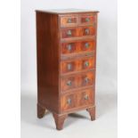 A late 20th century reproduction mahogany tall chest, fitted with a central slide, on bracket