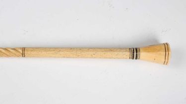 A 19th century scrimshaw whalebone walking cane with spiral reeded and octagonal shaft beneath