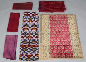 A mixed group of ethnic textiles, including a large Phulkari silk embroidered panel, Northern