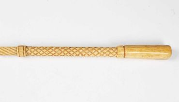 A 19th century scrimshaw whalebone walking cane with spiral reeded and lattice carved bands