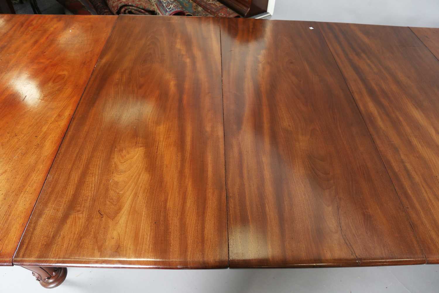 A large early Victorian mahogany pull-out extending dining table, the rectangular top with three - Image 3 of 7