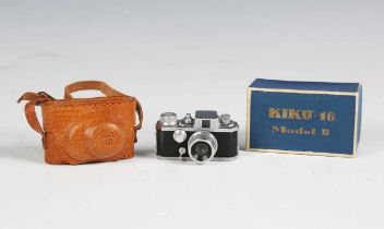 A Kiku-16 Mode II miniature camera, with leather case and card box.