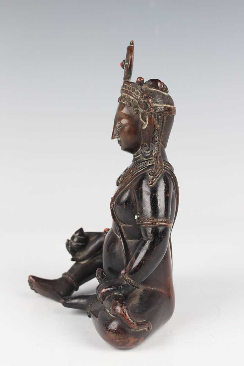 A Sino-Tibetan brown patinated copper alloy/bronze figure of Jambhala, late Qing dynasty, with - Image 7 of 8