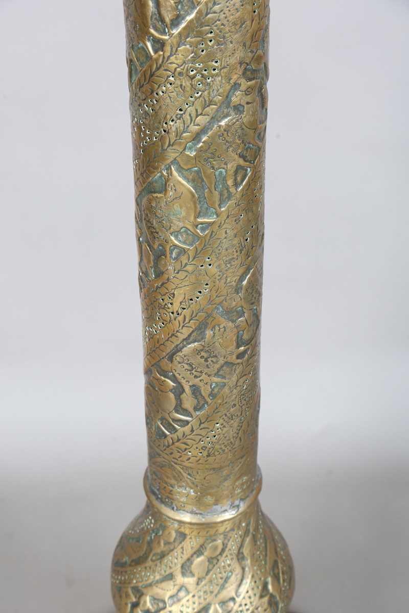 An Islamic brass floor lamp, circa 1900, the flared surmount and cylindrical column decorated with - Image 22 of 24