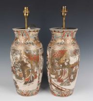 A pair of Japanese Satsuma earthenware vases, Meiji period, each of shouldered tapering form,