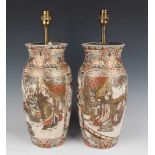 A pair of Japanese Satsuma earthenware vases, Meiji period, each of shouldered tapering form,