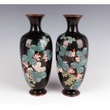 A pair of Japanese cloisonné vases, Meiji period, each elongated ovoid body decorated with flowering