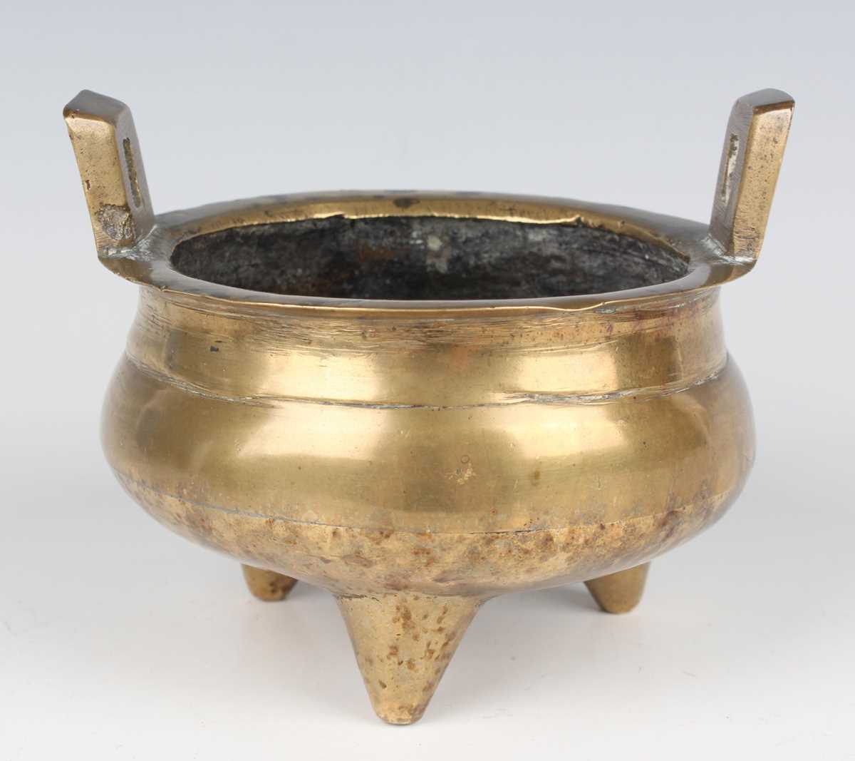 A Chinese brown patinated bronze tripod censer, Qing dynasty, of low-bellied circular form on - Image 7 of 14