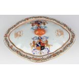 A Chinese armorial export porcelain tureen and cover, 19th century, of shaped oval form, the cover