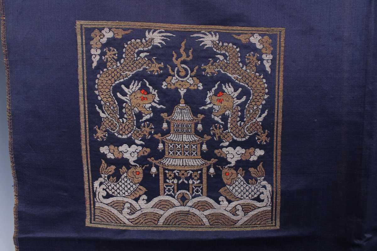 A Chinese blue silk embroidered rectangular panel, 20th century, worked with eight matching rank - Image 27 of 70