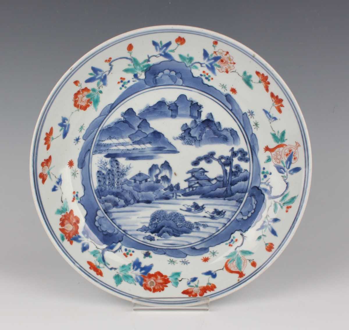 A Japanese Kakiemon porcelain circular dish, Edo period, circa 1700, the centre painted in