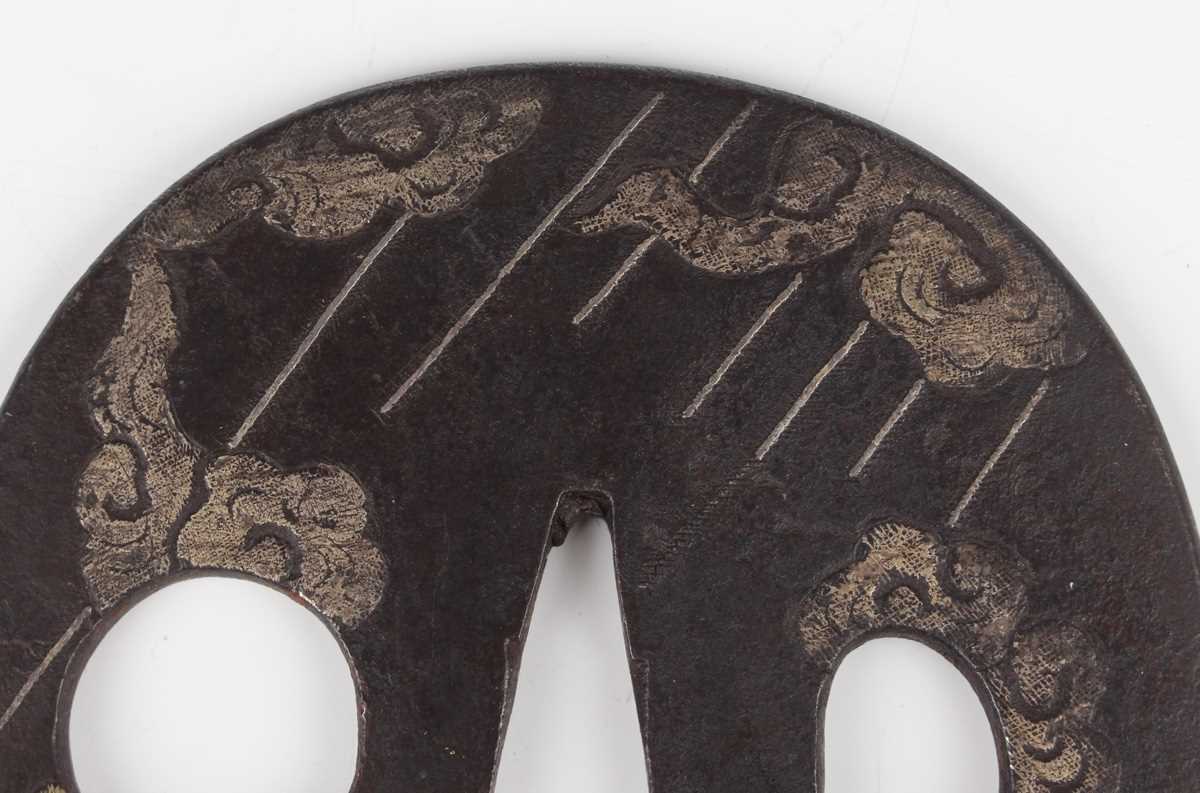 A Japanese cast iron oval tsuba, Edo period, with silver damascened dragon and vapour decoration, - Image 6 of 9