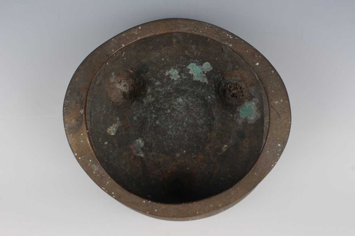 A Chinese bronze bombé censer, 19th/20th century, of low-bellied circular form with a pair of loop - Image 5 of 7
