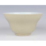 A Chinese pale café-au-lait glazed porcelain ogee form bowl, mark of Daoguang but later, of steep-