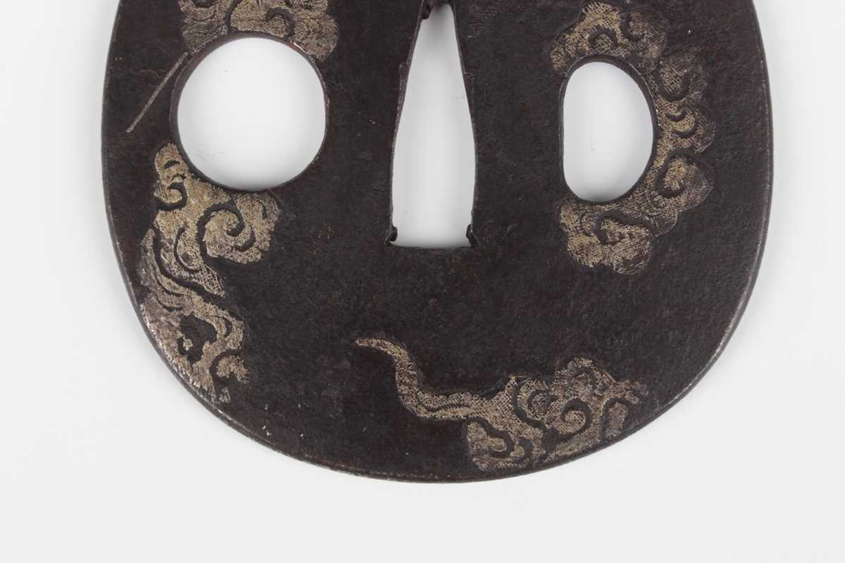 A Japanese cast iron oval tsuba, Edo period, with silver damascened dragon and vapour decoration, - Image 8 of 9